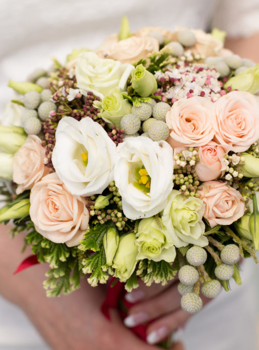 Pink bridal bouquet in bride's hands