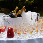 Drinks table at wedding or event, champagne, cocktails, punch, pimms