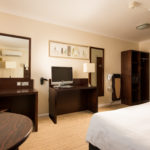 Classic double bedroom at Mercure Norwich Hotel, double bed, side table, desk with TV, wardrobe