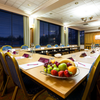 The Club Room at Mercure Norwich Hotel, set up for a meeting, fruit bowl on table