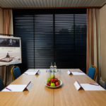 The First Avenue meeting room at Mercure Norwich Hotel, set up for a meeting, bowl of apples on the table